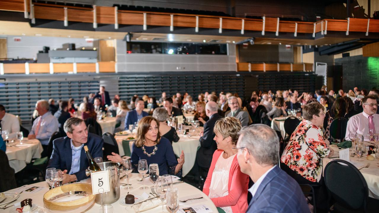 People happily talking during the Pathways Inc Annual Fundraiser in 2018
