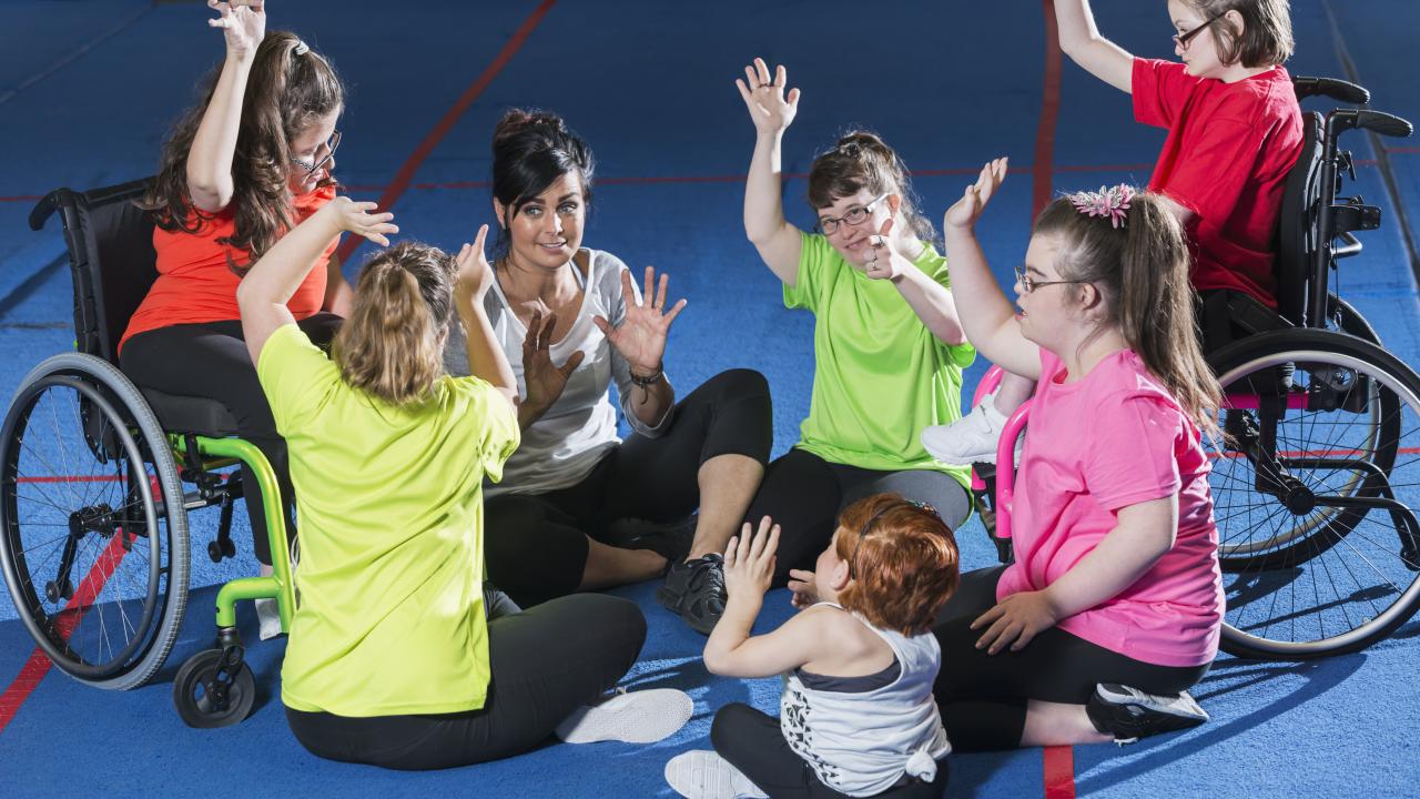 A group of individuals exercising in a gym