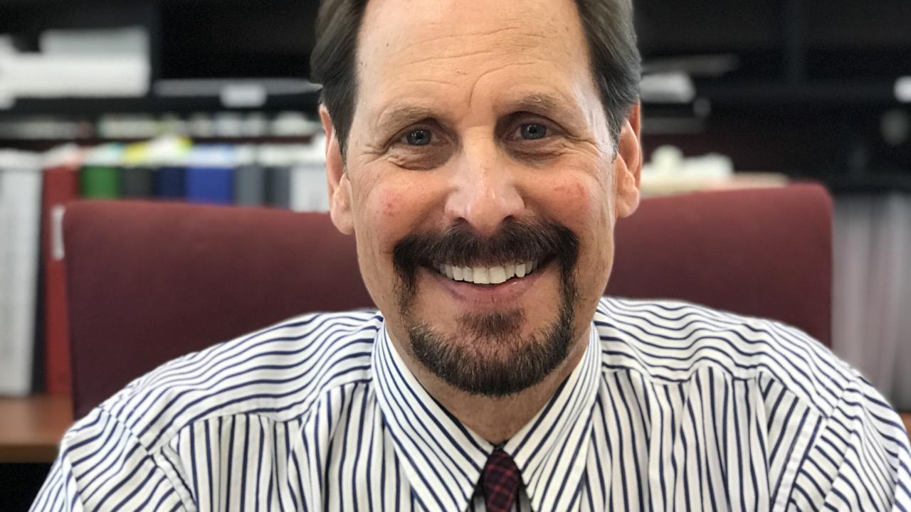 Dr. Edward Lukomski, CEO and President of Pathways, Inc. sits at his desk