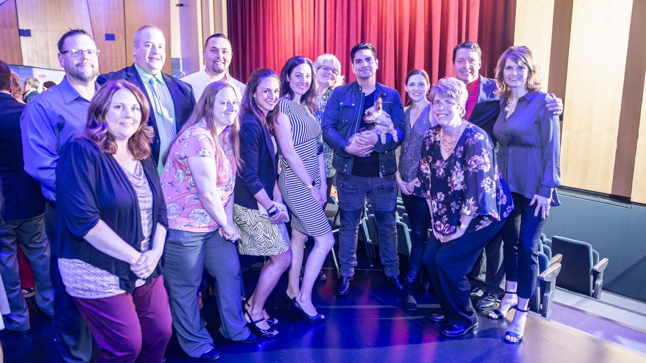 Wegmans staff standing with Jason Bishop at the 2019 Pathways Inc Annual Fundraiser