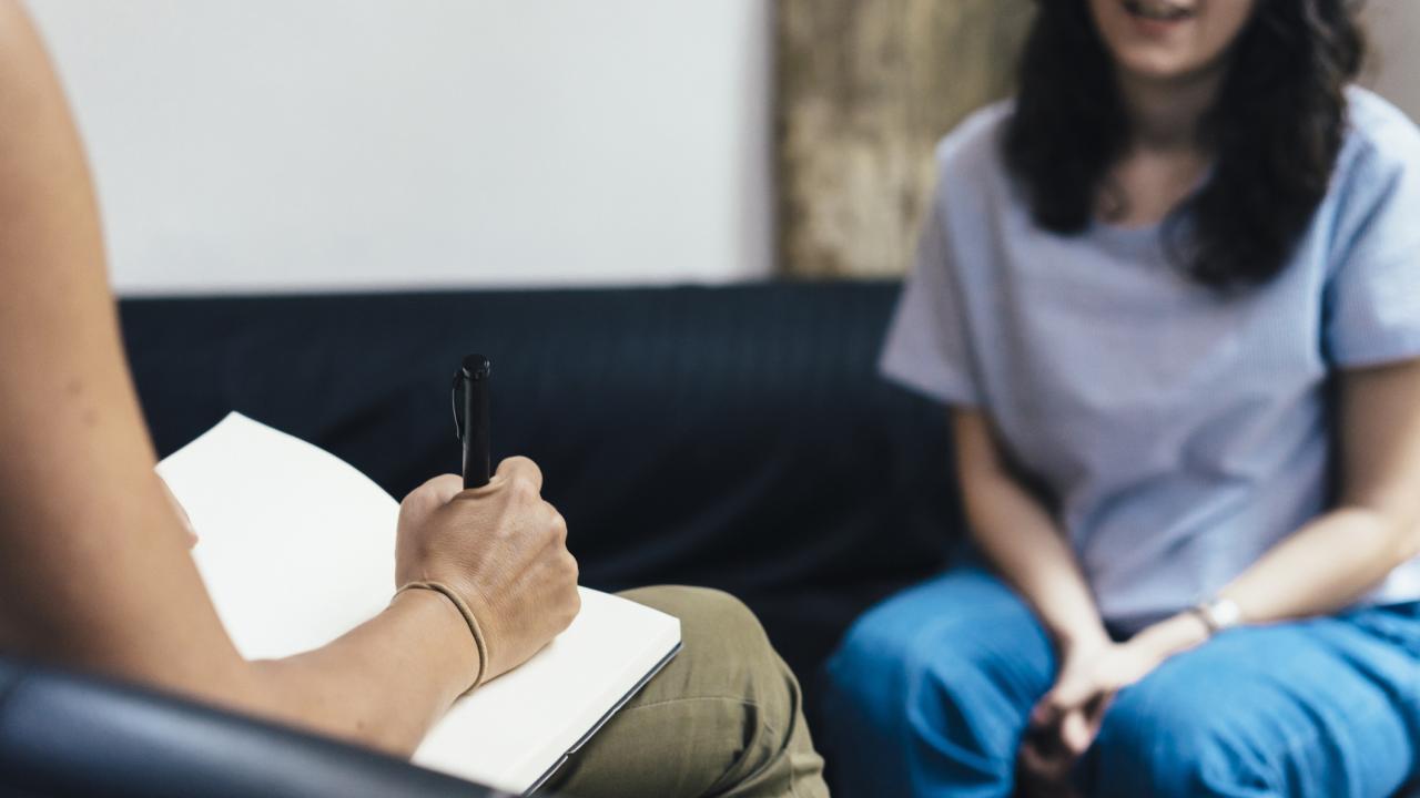 Woman speaking with an adult care manager