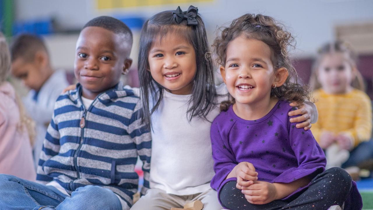 Three children at a childcare center