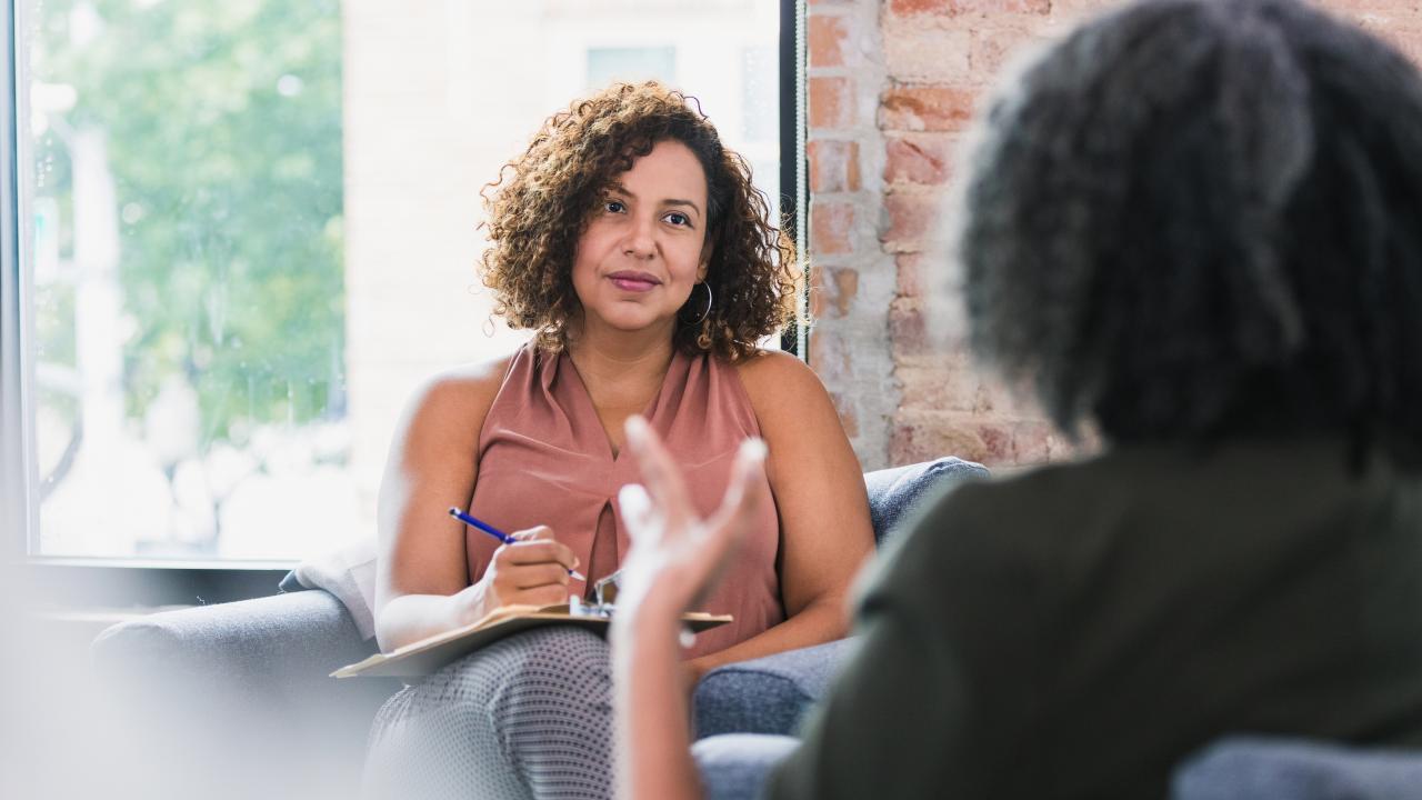 woman speaking with a female therapist