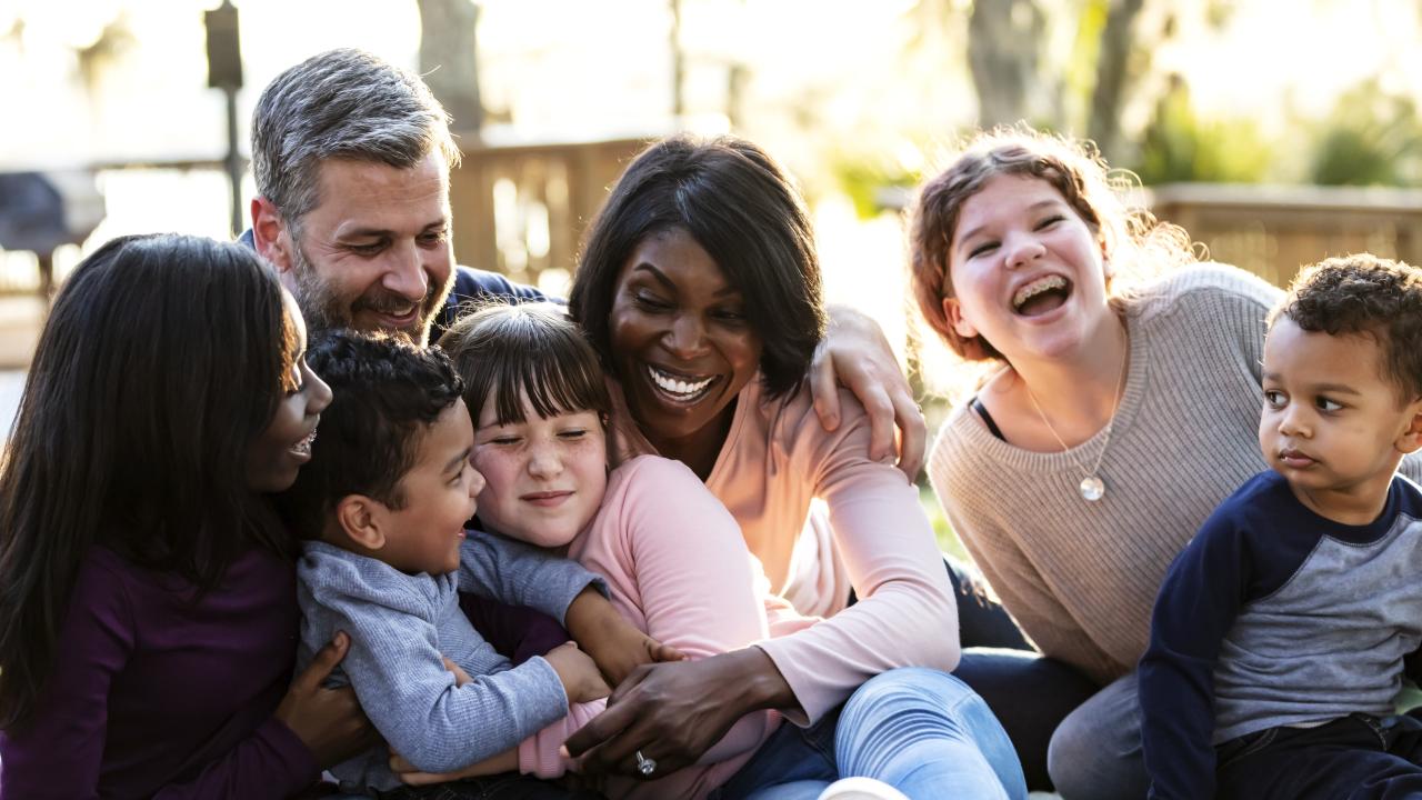 A family of seven laughing together