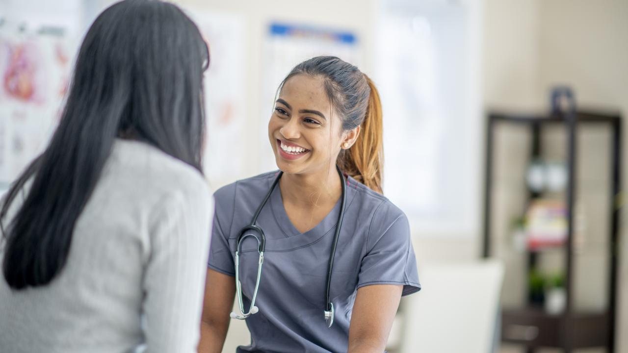 Female nurse working with a female patient