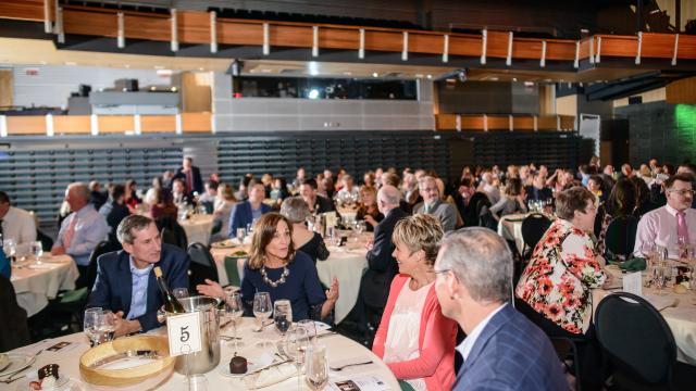 A group of people chatting during the Annual Fundraiser dinner