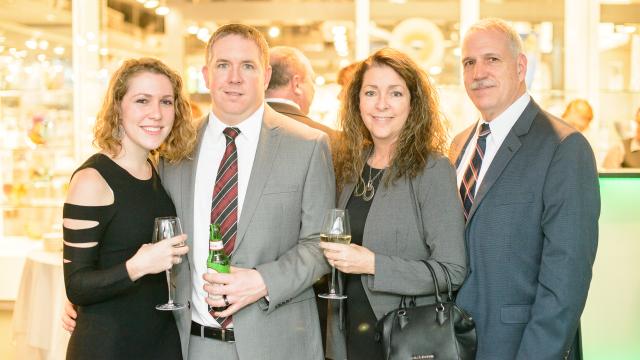 Four people smiling at the Annual Fundraiser