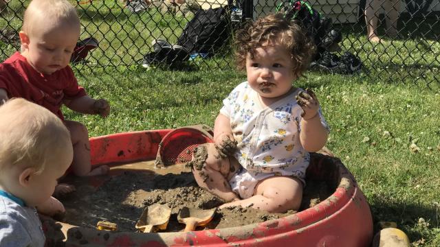 A child playing with mud