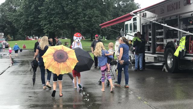 A family walking with an umbrella during the event