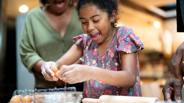 Young girl and woman baking together